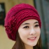 Knitted beret - a warm fur hat with decorative flowers