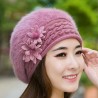 Knitted beret - a warm fur hat with decorative flowers