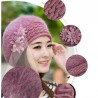 Knitted beret - a warm fur hat with decorative flowers