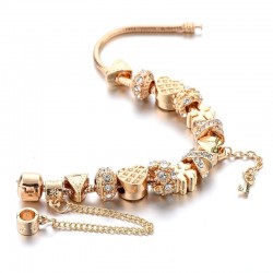 Trendy gold bracelet with charms - hearts - beads - clover - key