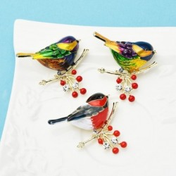 A bird sitting on a branch - crystal broochBrooches