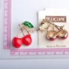 Elegant brooch with a red crystal cherry