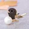 Vintage bird-shaped brooch with pearl