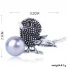 Vintage bird-shaped brooch with pearl