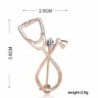 Stethoscope shaped brooch with crystal