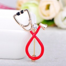 Stethoscope shaped brooch with crystal