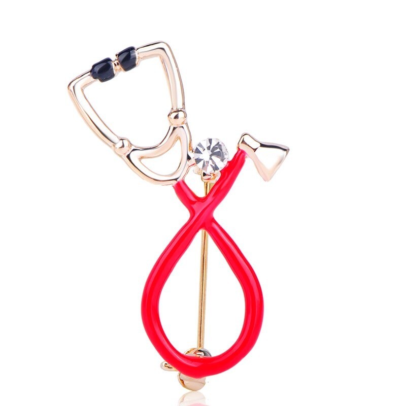 Stethoscope shaped brooch with crystal