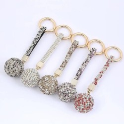 Chaveiro com bola de cristal / pulseira de couro