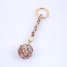 Chaveiro com bola de cristal / pulseira de couro