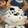 Brinquedo de pelúcia em forma de vaca dos desenhos animados