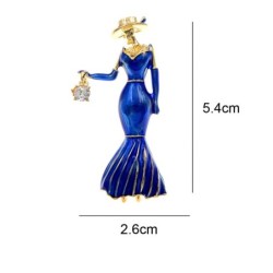 Broche da moda - uma mulher de vestido azul com uma bolsa de cristal