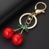 Chaveiro vermelho em forma de cereja - com cristal verde