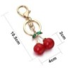 Chaveiro vermelho em forma de cereja - com cristal verde