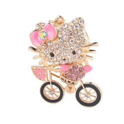 Gatinho de cristal em uma bicicleta - chaveiro