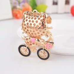 Gatinho de cristal em uma bicicleta - chaveiro