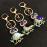 Golden crystal owl - green leaves - keychainKeyrings