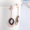 Brincos longos em ouro rosa - círculos ovais triplos