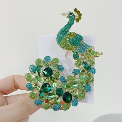 broche de pavão de cristal
