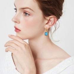 Brincos dourados com topázio cristal azul / strass