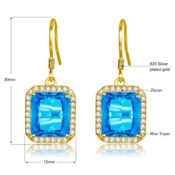 Brincos dourados com topázio cristal azul / strass