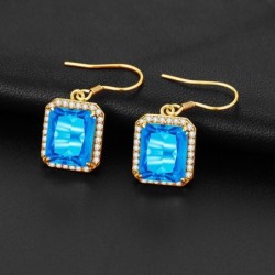Brincos dourados com topázio cristal azul / strass
