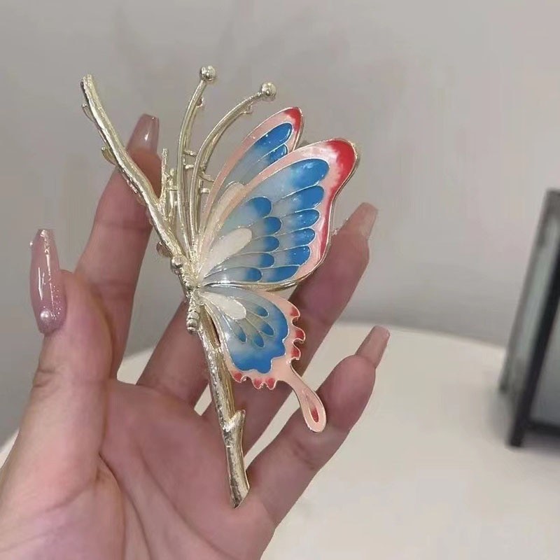 grampo de cabelo em forma de borboleta