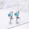 Brincos redondos de prata com estrela de cristal azul