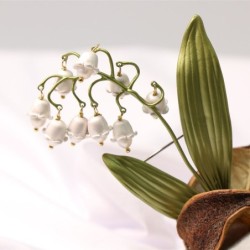 Broche de lírio do vale