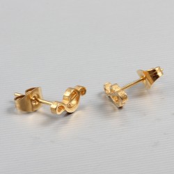 Brincos de notas de música dourada