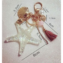 Chaveiro com estrelas-peixe e pérolas